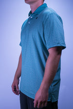 Person wearing a premium golf polo with a design on it