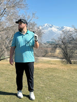 Golfer standing on tee box ready to hit