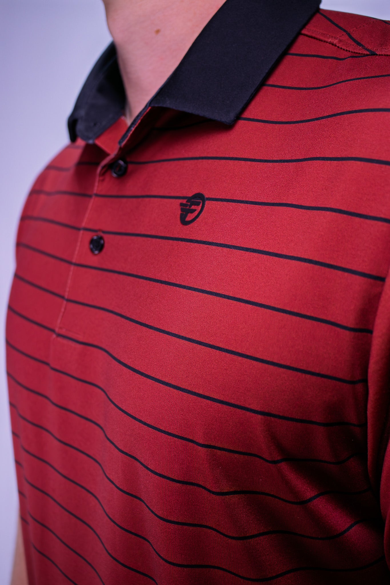 The best golf polo that is red with black stripes, gives you some sunday swagger while wearing it out on the course