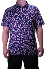 Person wearing a short-sleeve shirt with a floral pattern on a white background