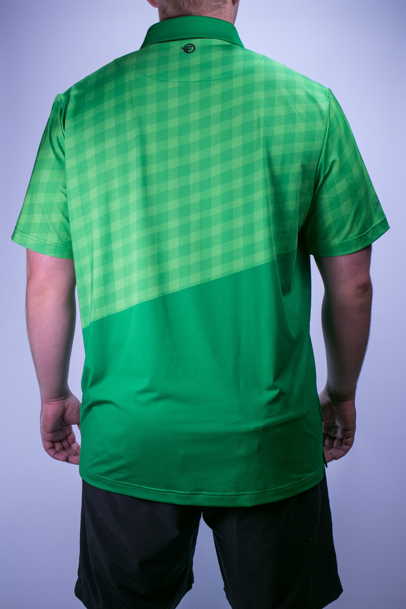 Green golf polo with gingham top and solid bottom half